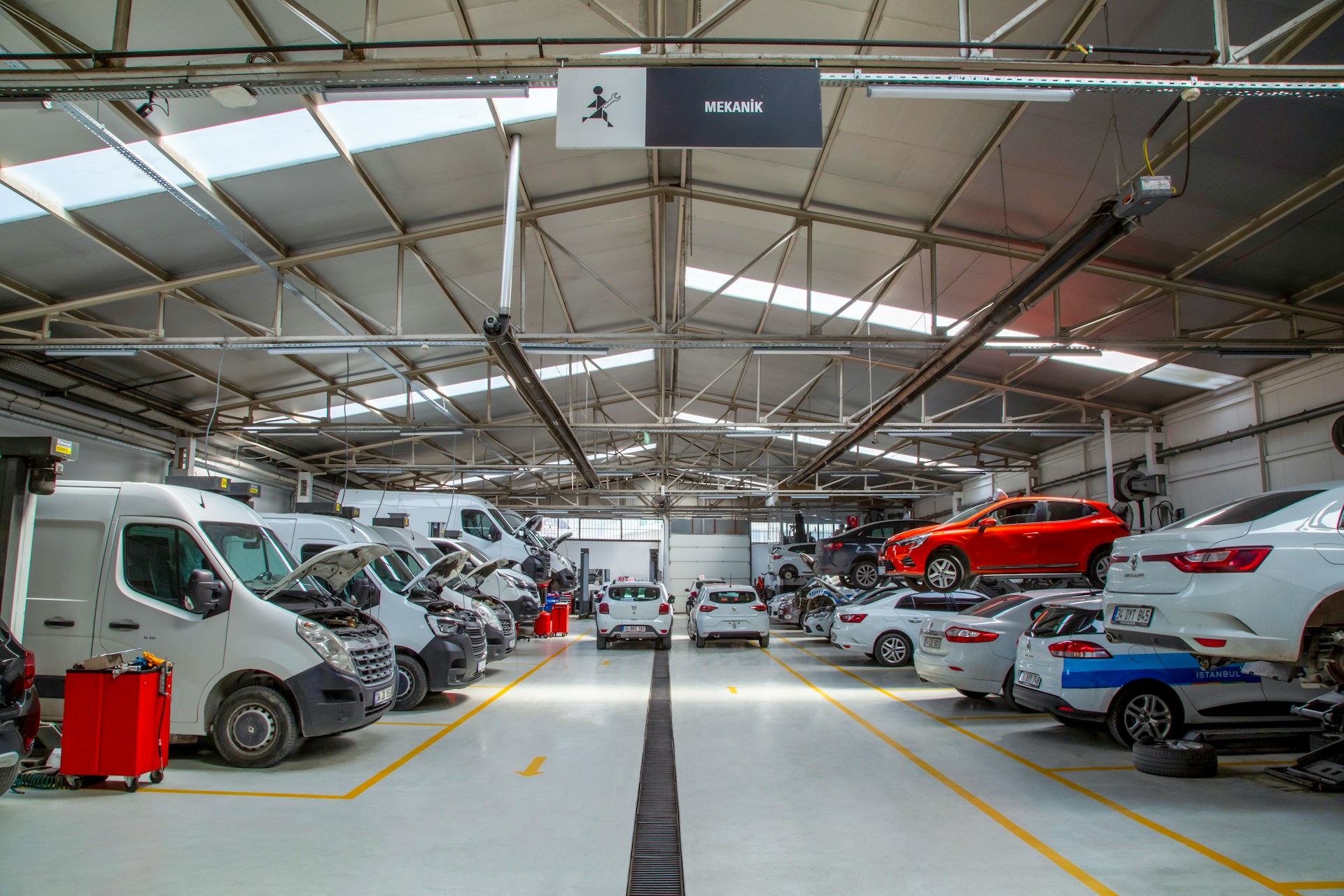 A warehouse filled with lots of cars and trucks
